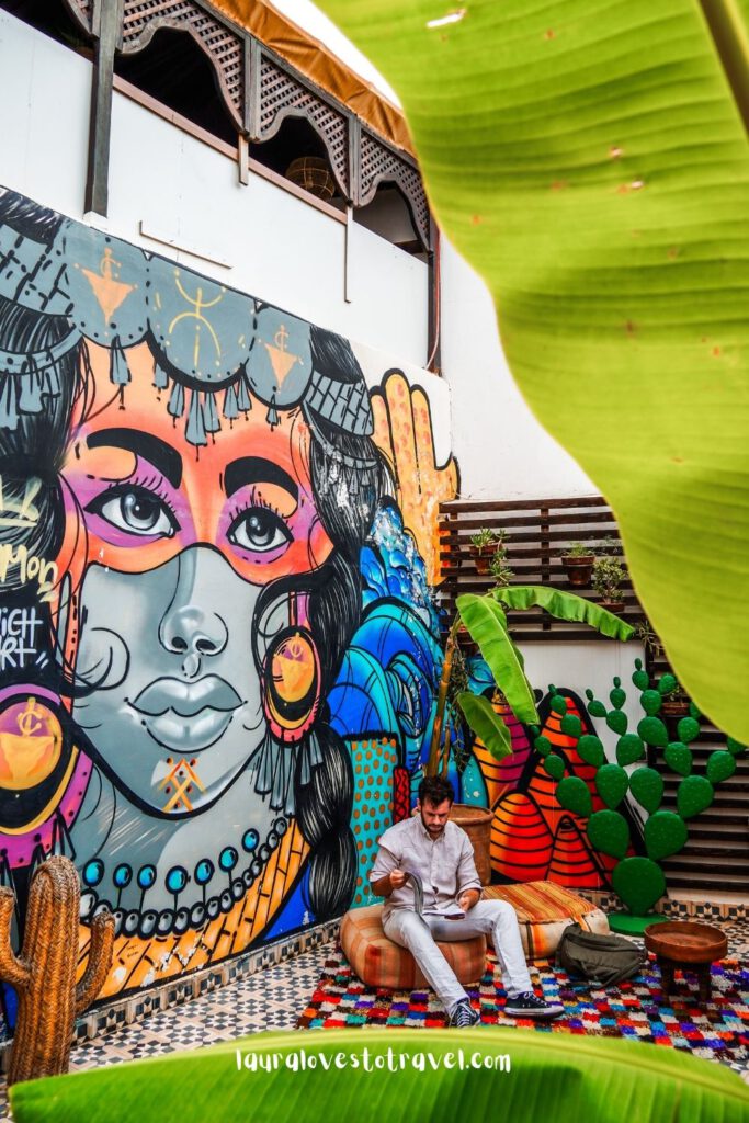 Outside patio with mural inside a riad in Marrakesh