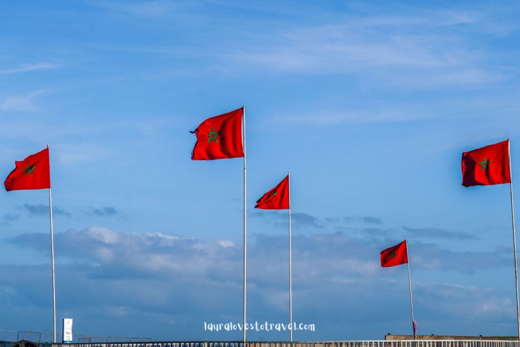 Moroccan flags next to the road in Morocco